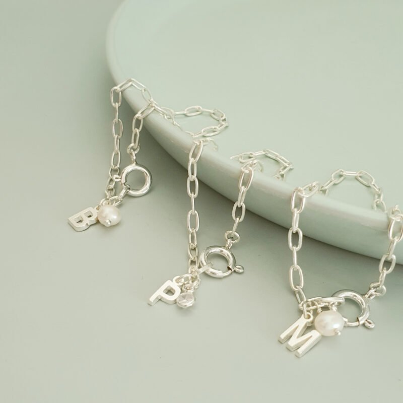 PULSERA INICIAL PLATA + PERLA ZIRCONIA